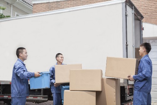 Packed boxes and furniture ready for transport in central London