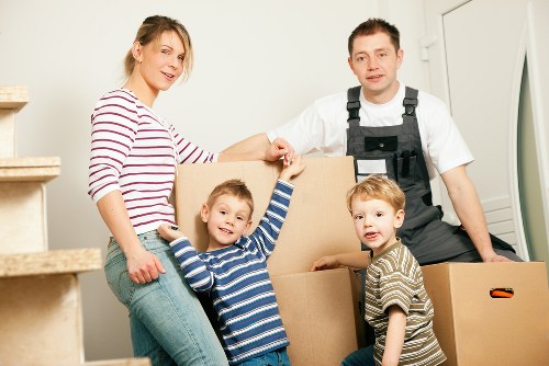 Professional movers handling items in a Westminster apartment building