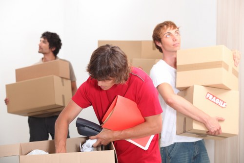 Office relocation team moving desks and equipment in Westminster