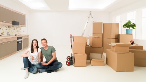 Moving crew handling items carefully during a property relocation