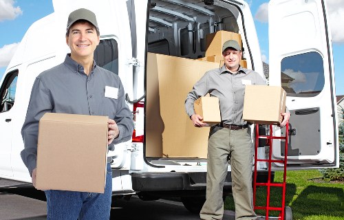 Careful loading of household items for a move in Westminster