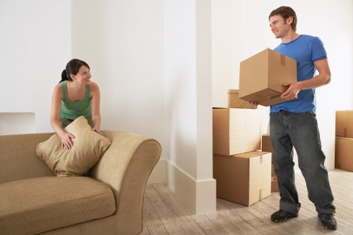 Professional moving team handling boxes in central London